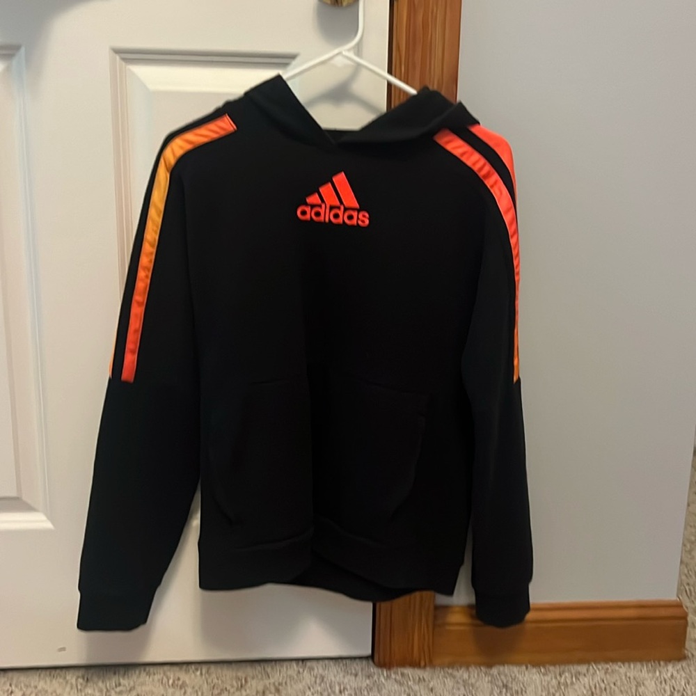 Black adidas hoodie with orange accents. Size: xl boys